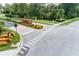 Street view of neighborhood entrance with brick signage and lush landscaping at 3227 Watermark Dr, Wesley Chapel, FL 33544