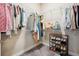 Walk-in closet with custom shelving and hanging racks for ample storage and organization at 3227 Watermark Dr, Wesley Chapel, FL 33544