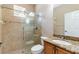 Bright bathroom with a walk-in shower, granite countertop vanity, and a clean, modern design at 3300 Stonegate Falls Dr, Land O Lakes, FL 34638