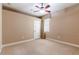 Simple bedroom with a window, closet, neutral carpet, and ample space for furnishings at 3300 Stonegate Falls Dr, Land O Lakes, FL 34638