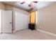 Cozy bedroom featuring neutral carpet, a window with curtains, and a closet for storage at 3300 Stonegate Falls Dr, Land O Lakes, FL 34638