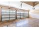 Spacious two-car garage with automatic doors and plenty of room for storage at 3300 Stonegate Falls Dr, Land O Lakes, FL 34638