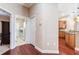 Hallway showcasing the kitchen and a convenient laundry room at 3300 Stonegate Falls Dr, Land O Lakes, FL 34638