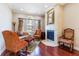 Cozy living room with a fireplace, large windows, and ample seating at 3300 Stonegate Falls Dr, Land O Lakes, FL 34638