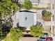 An aerial view of a home with a new roof, deck, landscaping, driveway and fencing at 3316 W Napoleon Ave, Tampa, FL 33611