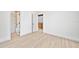 Bright bedroom with new floors, and multiple doorways at 3316 W Napoleon Ave, Tampa, FL 33611