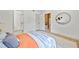 Comfortable bedroom with a bed, decorative accents, and view of the house interior at 3316 W Napoleon Ave, Tampa, FL 33611
