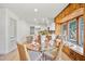 Bright dining area with a glass table, wicker chairs, and a window seat at 3316 W Napoleon Ave, Tampa, FL 33611