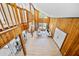 Bright living room boasts high ceilings, wood paneling, and large windows for natural light at 3316 W Napoleon Ave, Tampa, FL 33611