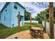 Relax in the backyard on the wood deck with a table and chairs, perfect for outdoor dining and entertaining at 3402 W Clifton St, Tampa, FL 33614