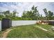 Large fenced backyard with shed and patio area, perfect for outdoor activities and privacy at 3402 W Clifton St, Tampa, FL 33614