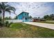 Charming two-story home featuring a quaint front porch, private white fence, and spacious front driveway at 3402 W Clifton St, Tampa, FL 33614