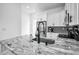 Kitchen with granite countertops, stainless steel appliances, and modern fixtures at 3402 W Clifton St, Tampa, FL 33614