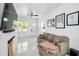 Contemporary living room boasts marble floors, recessed lighting, modern furniture, and a mounted flatscreen TV at 3402 W Clifton St, Tampa, FL 33614