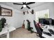 Office space with ceiling fan, closet, two desks, and a window that provides a bright workspace at 3402 W Clifton St, Tampa, FL 33614
