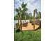 Charming wooden deck with outdoor seating, a planter, and a fire pit, ideal for entertaining at 3402 W Clifton St, Tampa, FL 33614