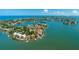 Picturesque aerial scene captures the charm of coastal living with waterfront homes, docks, and bay views at 371 12Th Ave, Indian Rocks Beach, FL 33785