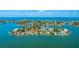 Desirable waterfront home featuring lush landscaping and private boat docks, perfect for coastal living at 371 12Th Ave, Indian Rocks Beach, FL 33785
