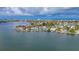 Panoramic shot of waterfront homes with boating access amidst a tranquil coastal neighborhood at 371 12Th Ave, Indian Rocks Beach, FL 33785