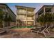 Gorgeous backyard with a pool, spa, and an outdoor staircase for easy access to all levels of the home at 371 12Th Ave, Indian Rocks Beach, FL 33785