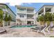 Gorgeous two-story home featuring a private backyard pool and spa with elegant stone patio at 371 12Th Ave, Indian Rocks Beach, FL 33785