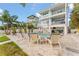 Serene outdoor space boasting a sparkling pool, lush landscaping, and comfortable lounge seating at 371 12Th Ave, Indian Rocks Beach, FL 33785