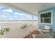 Beautiful water views from a balcony with comfortable seating and white railing at 371 12Th Ave, Indian Rocks Beach, FL 33785