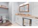 Well-lit bathroom with modern vanity, marble countertops, and a dedicated laundry area for added convenience at 371 12Th Ave, Indian Rocks Beach, FL 33785
