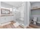 Modern bathroom featuring a spacious walk-in shower, marble countertops, and stylish fixtures at 371 12Th Ave, Indian Rocks Beach, FL 33785