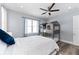 Bright bedroom features unique bunk beds, ceiling fan, and light blue paint at 371 12Th Ave, Indian Rocks Beach, FL 33785