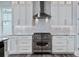 Modern kitchen featuring stainless steel appliances, custom backsplash, and lots of storage at 371 12Th Ave, Indian Rocks Beach, FL 33785