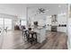 The large open floor plan flows seamlessly from the kitchen featuring stainless appliances into the living room at 371 12Th Ave, Indian Rocks Beach, FL 33785