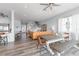 Spacious living room with a modern kitchen and staircase, featuring hardwood floors and recessed lighting at 371 12Th Ave, Indian Rocks Beach, FL 33785