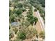 Aerial view highlighting expansive lot with mature trees and a well-maintained neighborhood, showcasing peaceful living at 4323 Culbreath Rd # B, Valrico, FL 33596