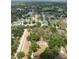 Aerial view of the residential neighborhood showcasing tree coverage, nearby lake, and established homes in the community at 4323 Culbreath Rd # B, Valrico, FL 33596
