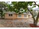 Backyard view showing the exterior of the house, foliage, and natural landscape elements behind the property at 4323 Culbreath Rd # B, Valrico, FL 33596
