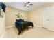 This bedroom features a ceiling fan, picture window, and closet at 4323 Culbreath Rd # B, Valrico, FL 33596