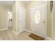 Inviting entryway with a decorative front door and light, wood-look flooring at 4323 Culbreath Rd # B, Valrico, FL 33596