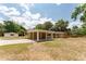 Charming brick home with a covered carport and spacious driveway and mature trees, perfect for outdoor activities at 4323 Culbreath Rd # B, Valrico, FL 33596