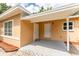 A covered entry offers protection from the elements, with two entry doors and unique patterned pavers at 4323 Culbreath Rd # B, Valrico, FL 33596
