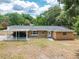 Brick home with a convenient covered carport, bay window, and lush trees adding to the curb appeal at 4323 Culbreath Rd # B, Valrico, FL 33596