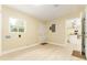 Spacious garage with bright natural light, neutral paint, access door, and white trim throughout at 4323 Culbreath Rd # B, Valrico, FL 33596