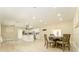 Open-concept kitchen featuring white cabinets, modern appliances, and an adjacent dining area at 4323 Culbreath Rd # B, Valrico, FL 33596