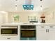 Kitchen island featuring modern appliances including a built-in microwave and cooktop at 4323 Culbreath Rd # B, Valrico, FL 33596