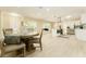Bright, open kitchen with a central island, stainless steel appliances, and dining area at 4323 Culbreath Rd # B, Valrico, FL 33596