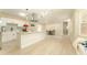 Open-concept kitchen with a kitchen island, dining area, and stainless steel appliances at 4323 Culbreath Rd # B, Valrico, FL 33596