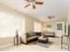 Bright living room with ceiling fans, neutral colors, and lots of natural light at 4323 Culbreath Rd # B, Valrico, FL 33596