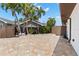 Enclosed backyard featuring brick floors, privacy fence, and lush foliage at 4331 13Th Ne Way, St Petersburg, FL 33703