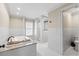 Bright bathroom featuring a soaking tub, granite countertop, and glass-enclosed shower at 4331 13Th Ne Way, St Petersburg, FL 33703