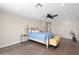 Comfortable bedroom boasts wood floors, plenty of natural light, and calming waterfront views at 4331 13Th Ne Way, St Petersburg, FL 33703